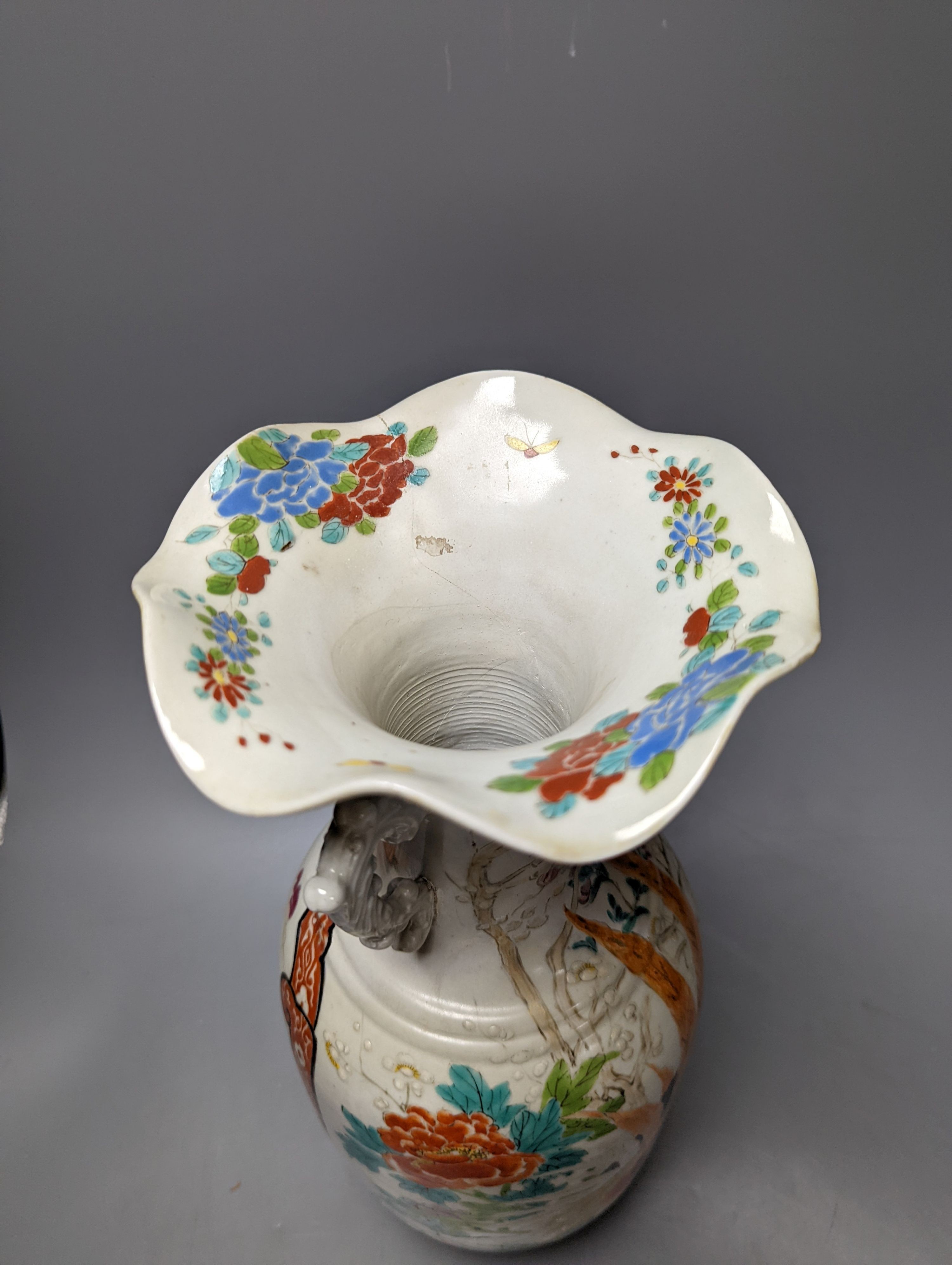 A Chinese famille rose vase and two ginger jars, together with a Japanese vase, 38cm